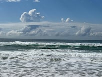 The changing patterns of sea and sky in a surfer’s playground.