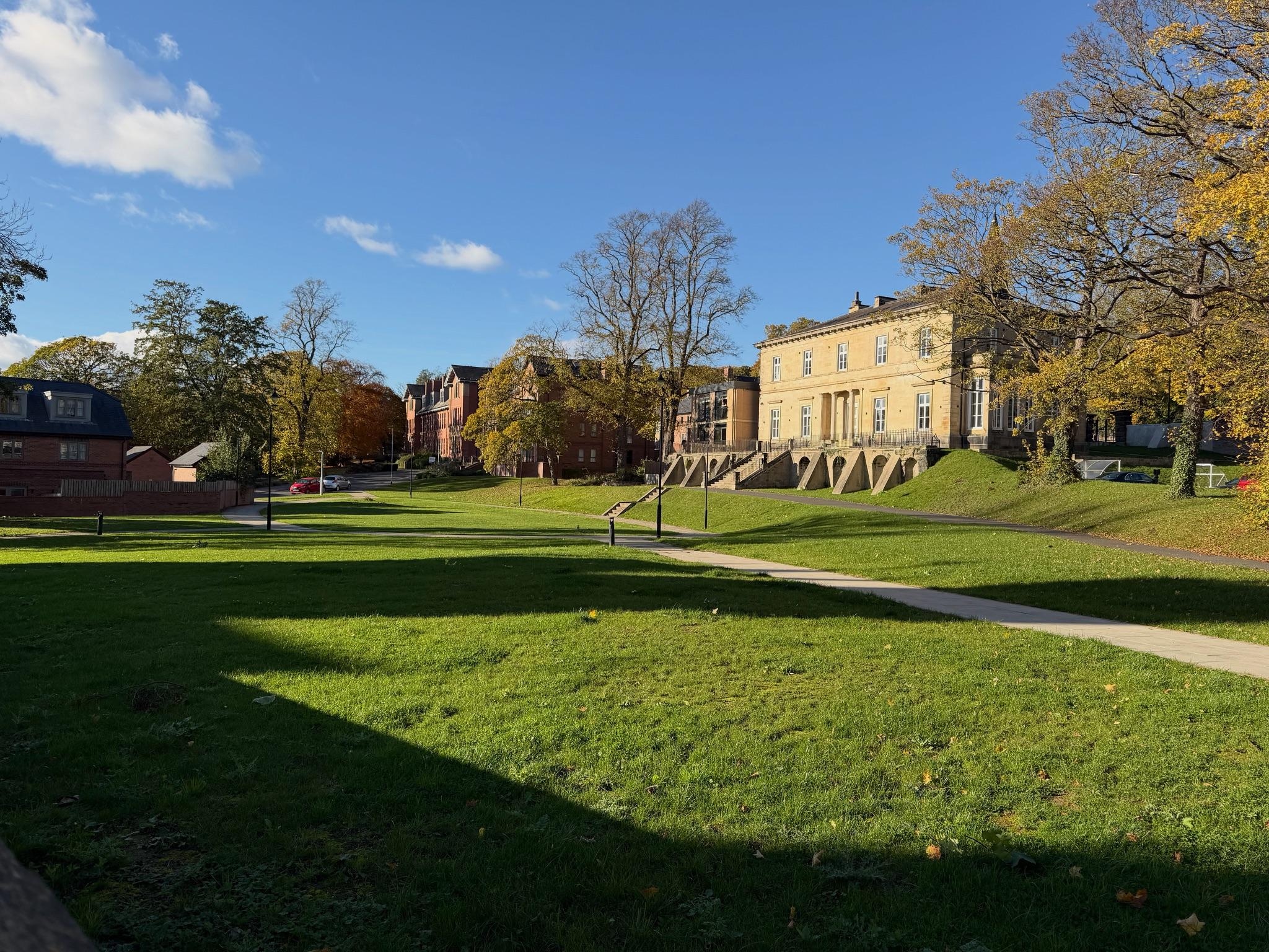 The flat is part of what looks like a listed building's grounds, and is a newer construction on the site.