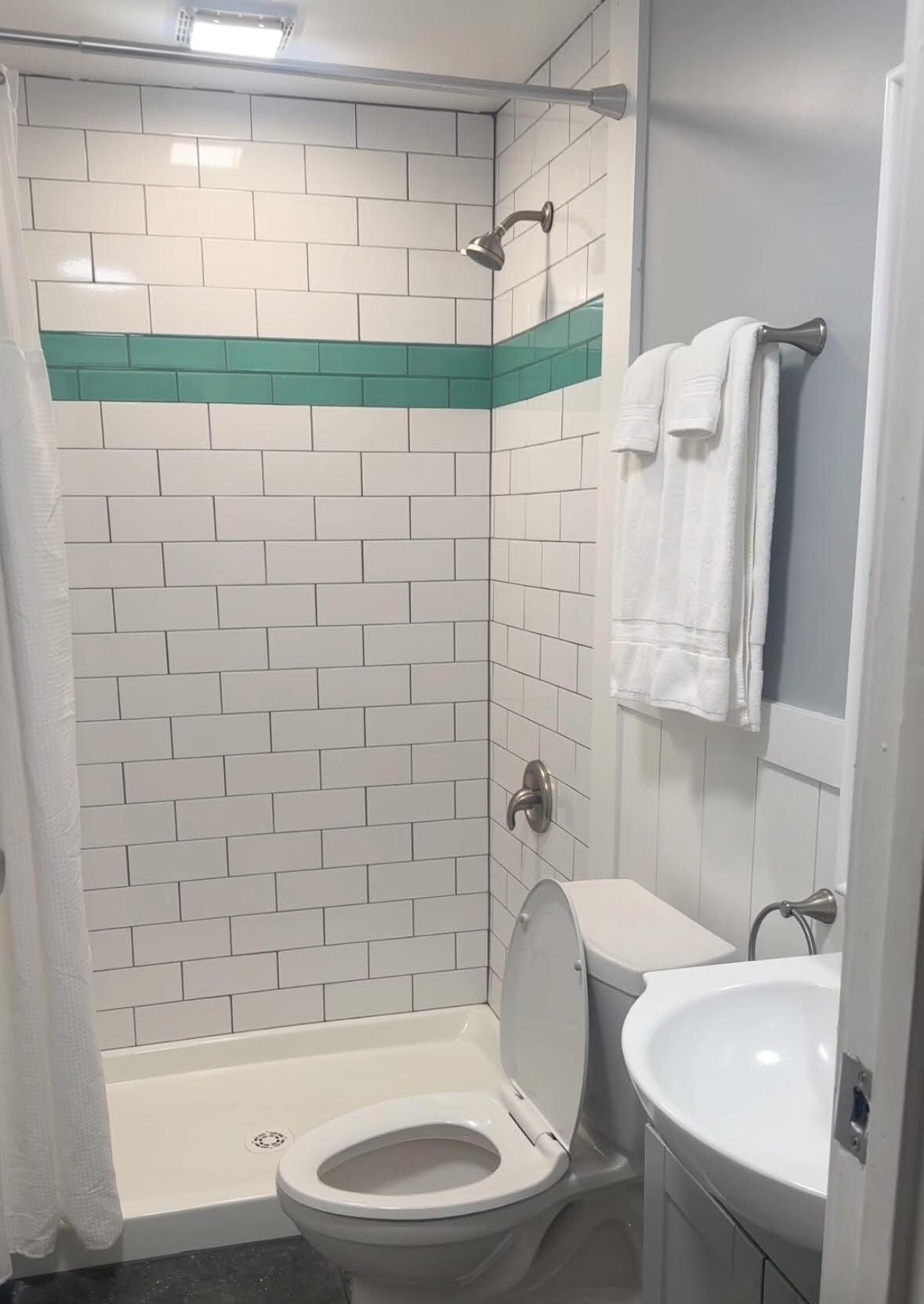 Clean bathroom with updated shower and fixtures