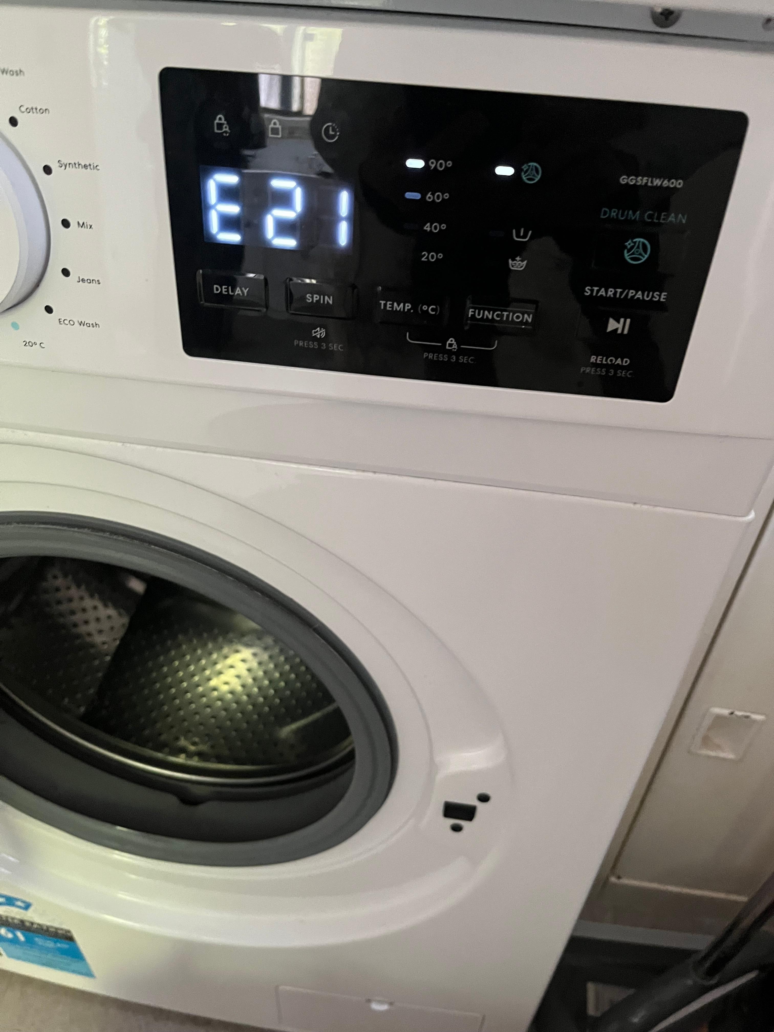 Error code on clothe washing machine with cloth stuck in machine 