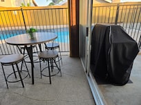 The grill is conveniently just outside of the patio area.