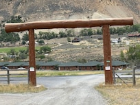 Entrance with cabins in background