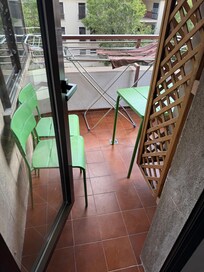 Tiny balcony, with a/c blowing on your face