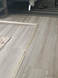 Floor in living room to front door.