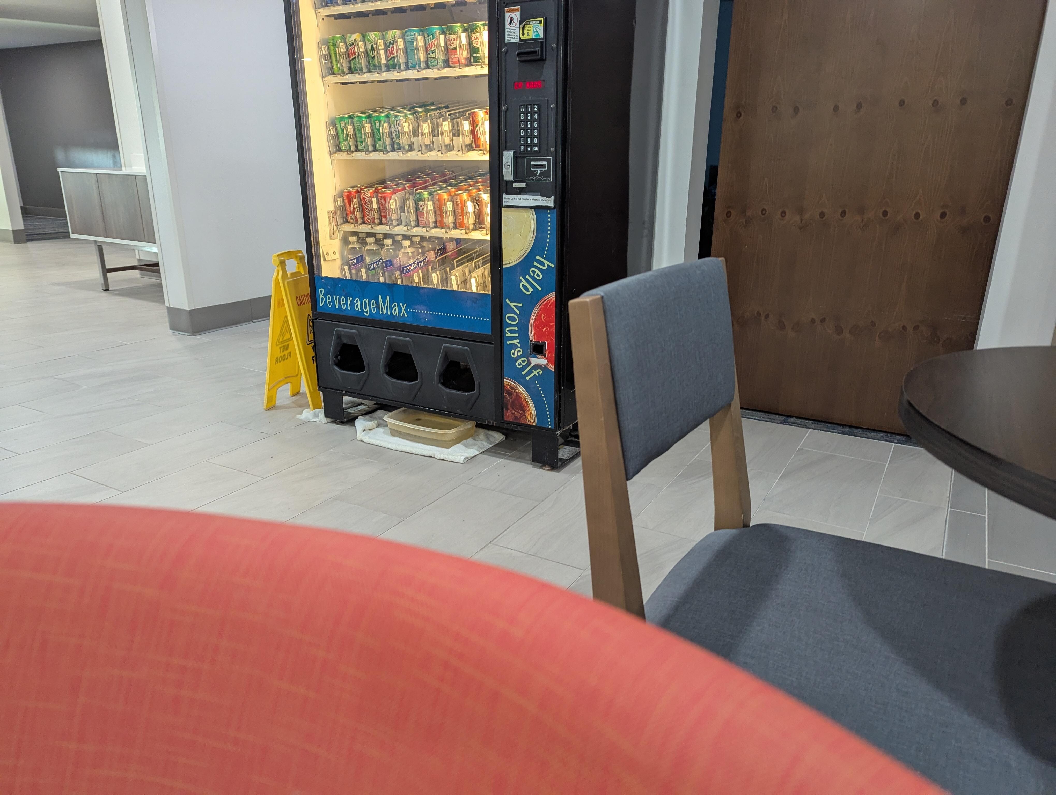 The vending machine was working but was "leaking" something.