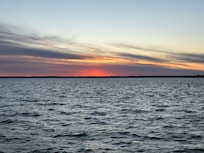 Worth crossing the highway to see sunset on the bay a block from the house