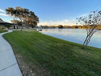 The path circling the lake, with the activity center and the pool.