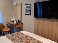 Refurbished room (narrow access at bed end)