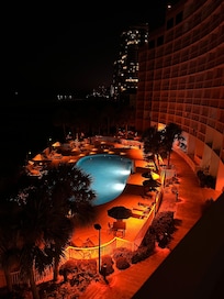 Night view of pool from balcony.