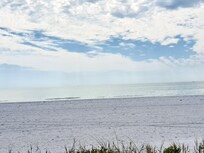 Closer view of the beach outside our unit. Barely any foot traffic as compared to the other end of the beach by Margaritaville.