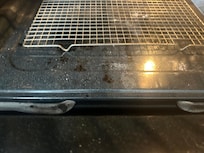 Nasty stove. Looks as if someone just took a roofer and attempted to paint over the ceilings