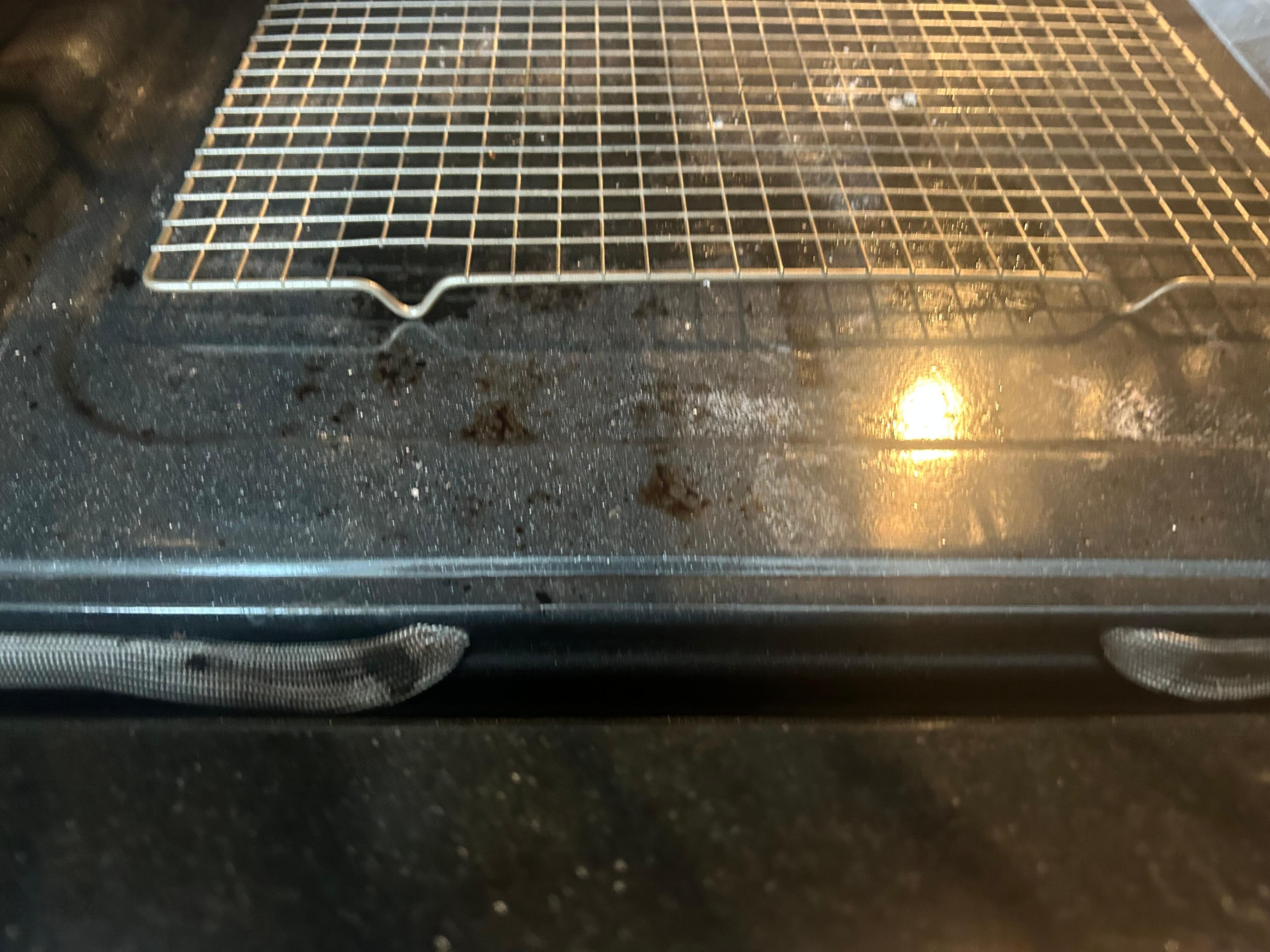 Nasty stove. Looks as if someone just took a roofer and attempted to paint over the ceilings