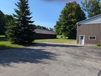 Big lot with a big shed with lots of bicycles and a ping pong table