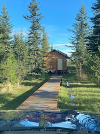 Front view of cabin and boardwalk