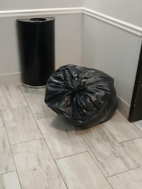 Trash near elevator smelled horrible throughput hallway.