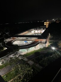 The outdoor swimming pool at night.