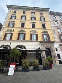 Outside of the apartment building.