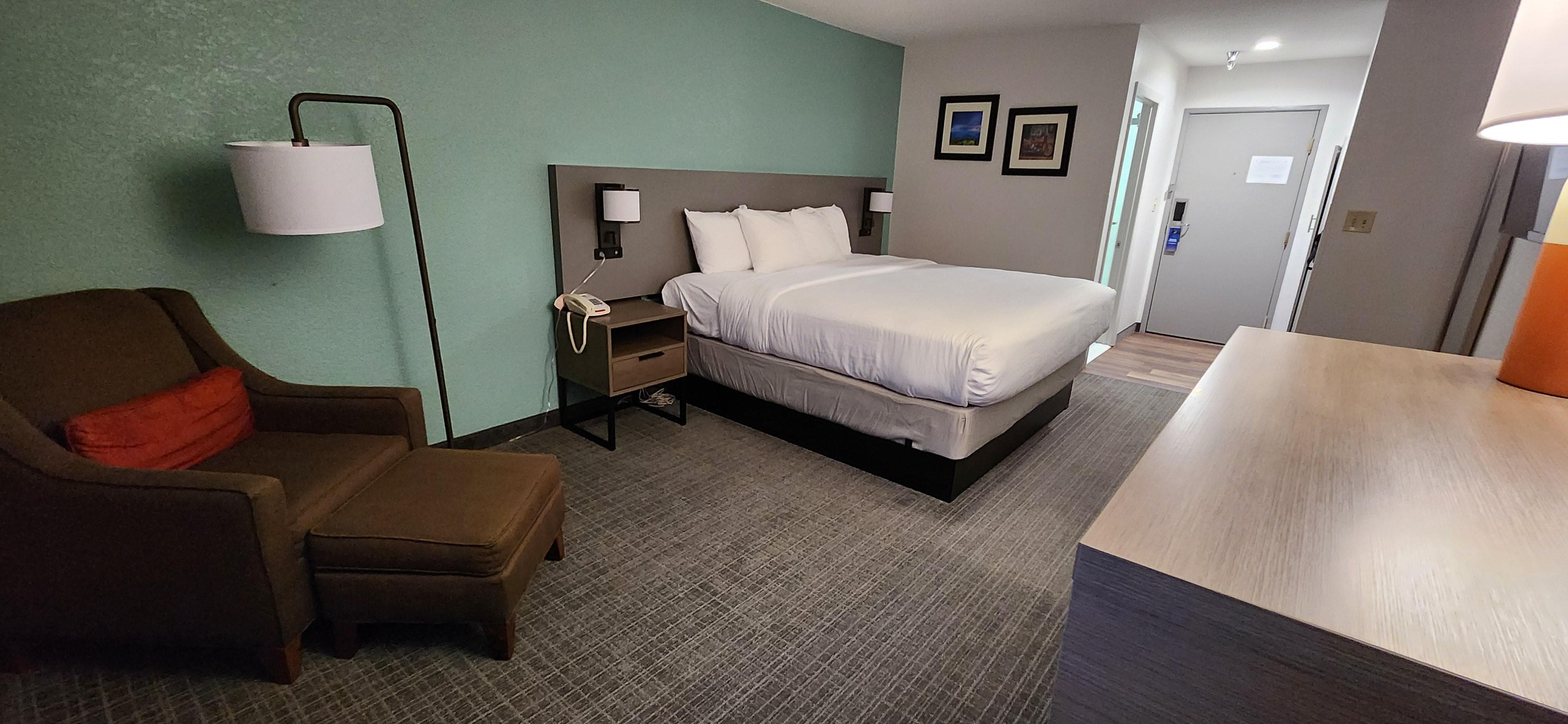 King size bed very comfortable with plenty of pillows and chair to put your feet up with a good book.