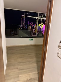 Full wedding across from room with 4 young kids trying to sleep.