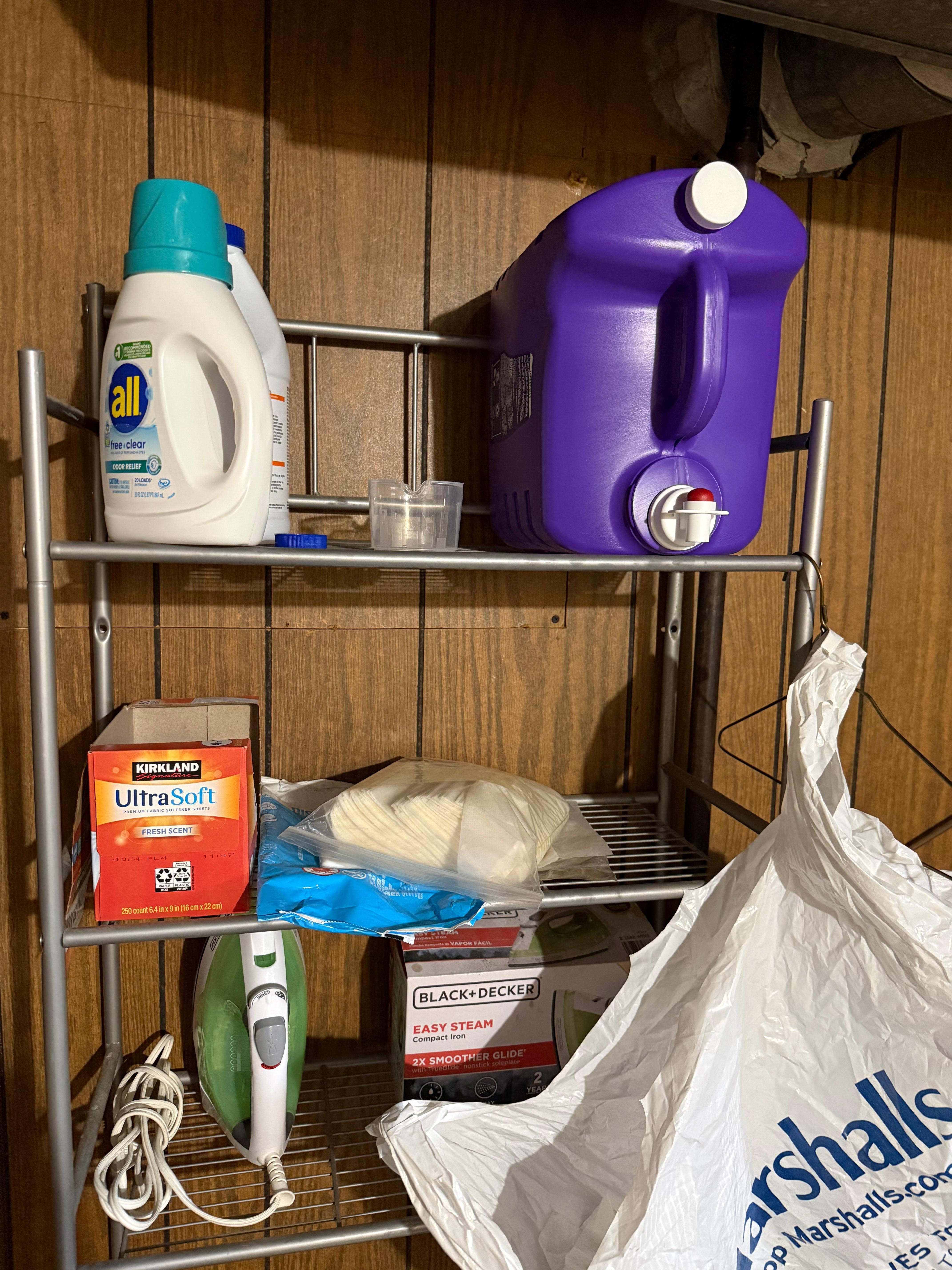 Full laundry room with laundry soap.