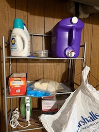 Full laundry room with laundry soap.