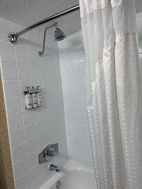 clean shower with multiple shower products , dove product products I think