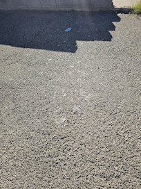 Broken glass on the driveway.
