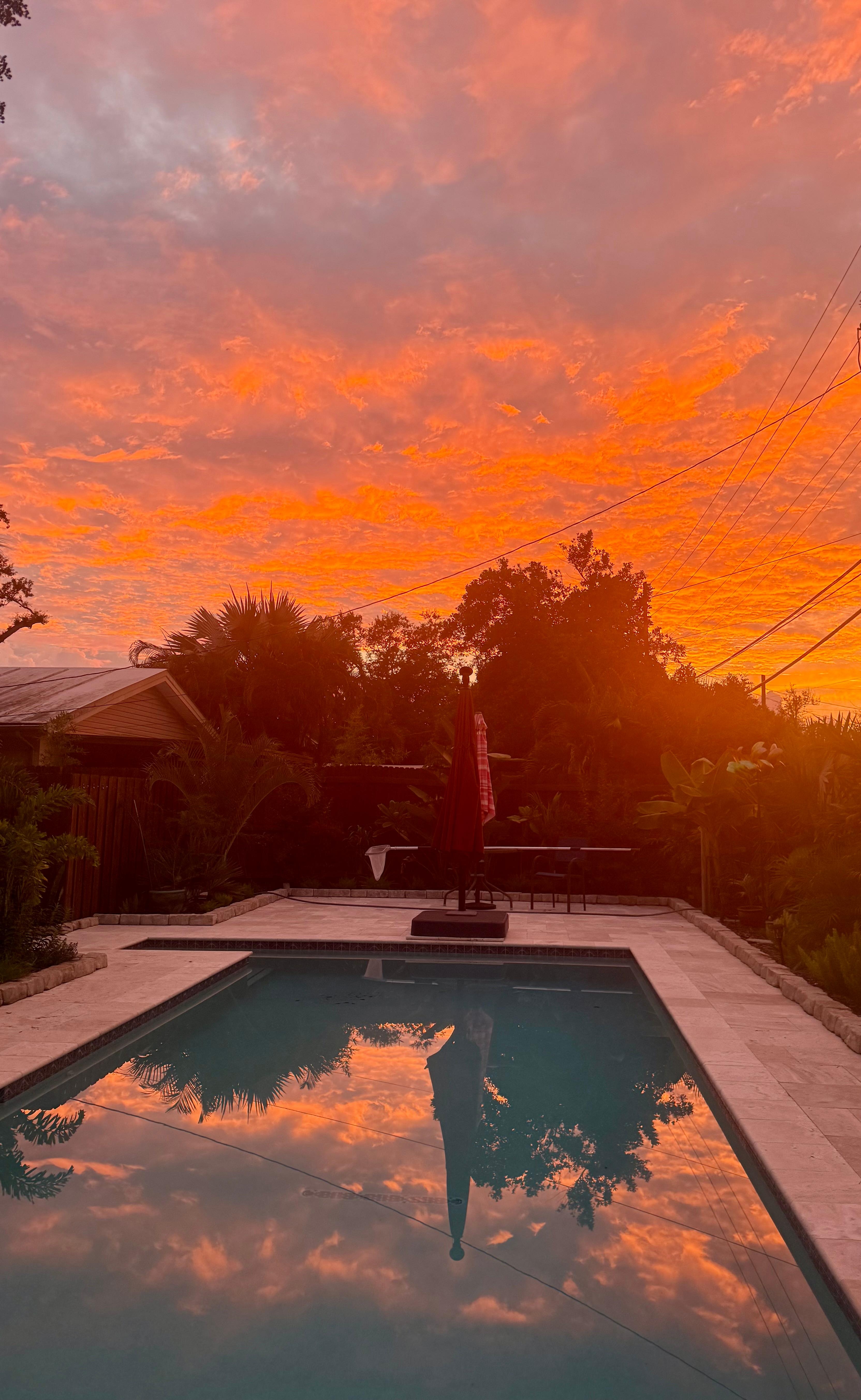 Comfy chairs, sparkling pool, and stunning sunset! 