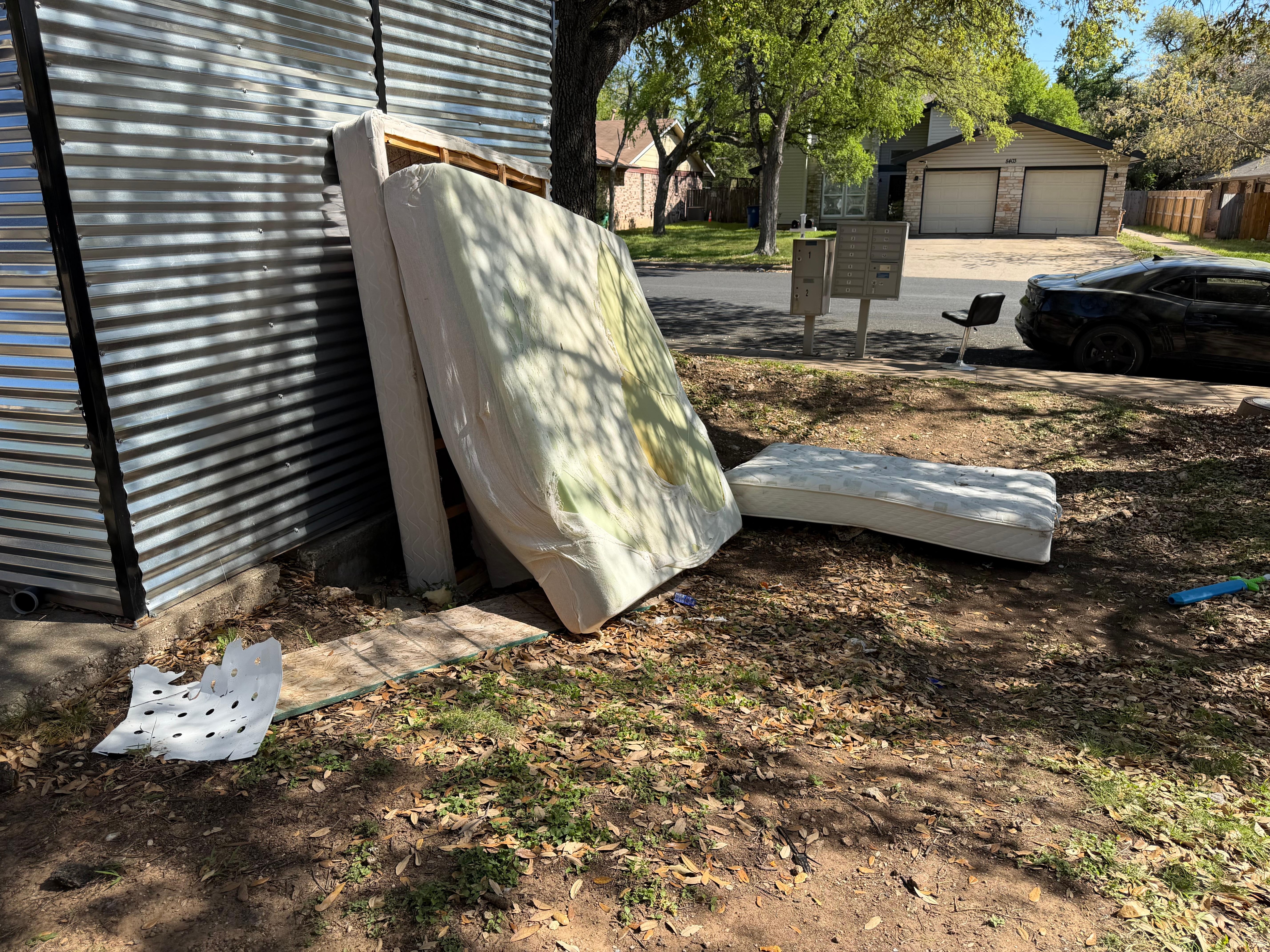 Filthy mattresses in front