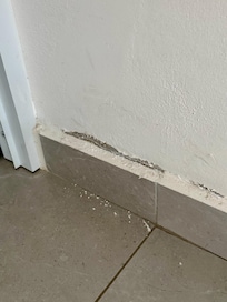 bedroom wall crumbling.