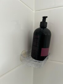 Shower gel holder not usable. If pressed on shower gel bottle, the holder will fall.