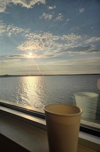 Morning coffee in the room with a sunrise on the lake.