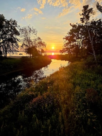 Sunset from the bridge to the beach at the condo Thursday 8/7/2025