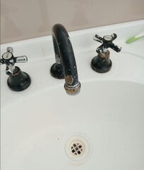 Misty Mountain tapware and stained vanity in the "Pristine" bathroom