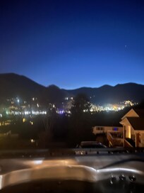 Nighttime view from the deck of the house