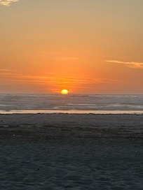 Sunset at the beach steps from the door.