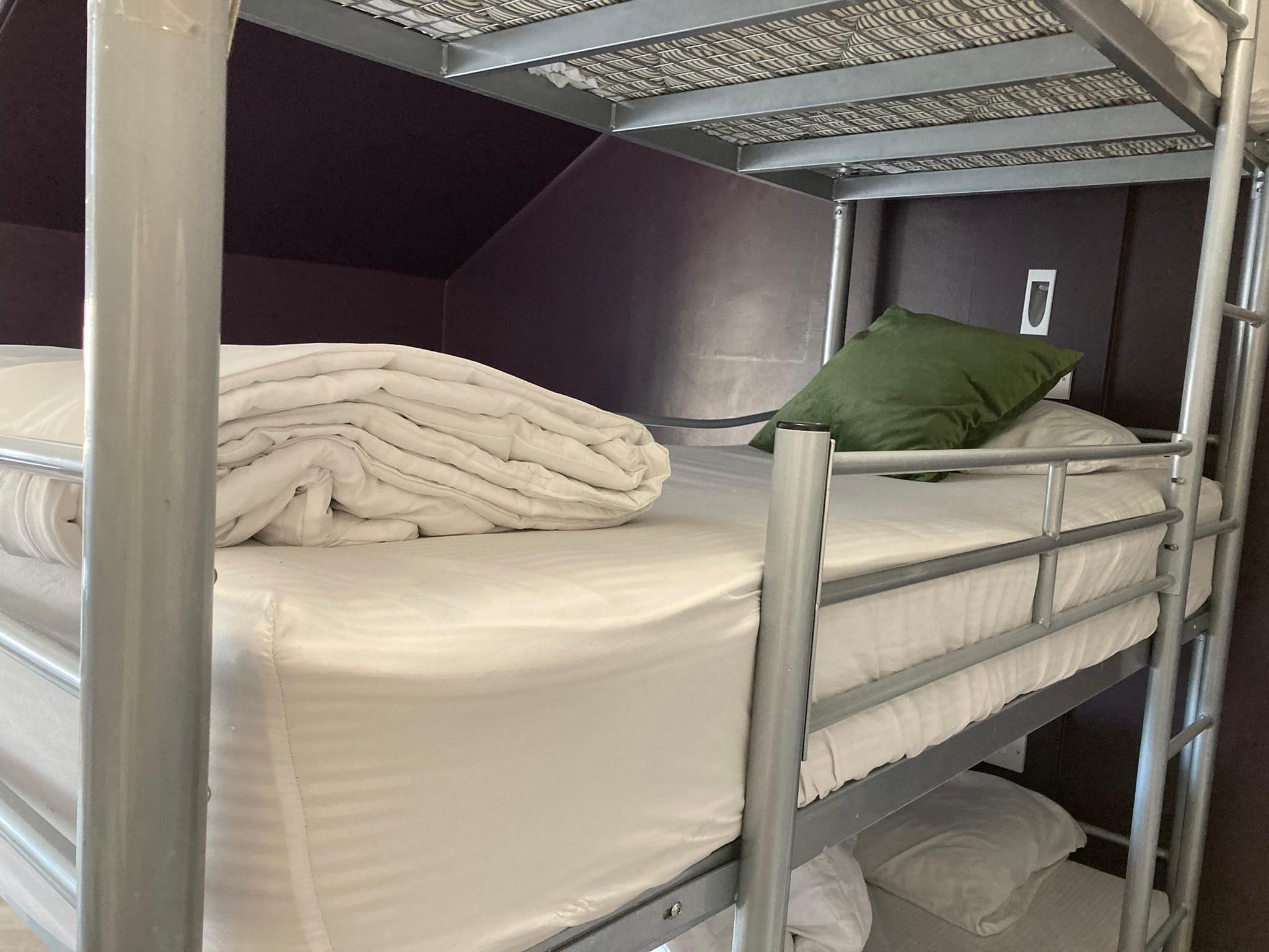 Unnecessary cushion on the bed that customers usually put the cushion onto the floor rather than leaving it on the bed