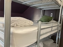 Unnecessary cushion on the bed that customers usually put the cushion onto the floor rather than leaving it on the bed