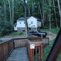 Undisclosed property directly beside the house and parking area