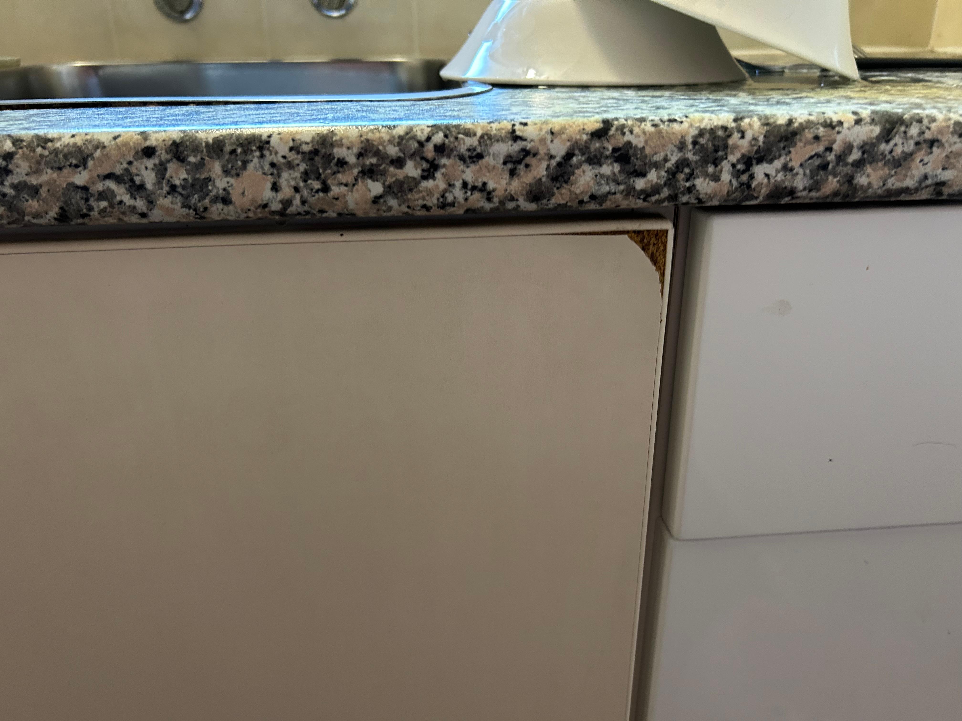 Worn out unmatching kitchen doors