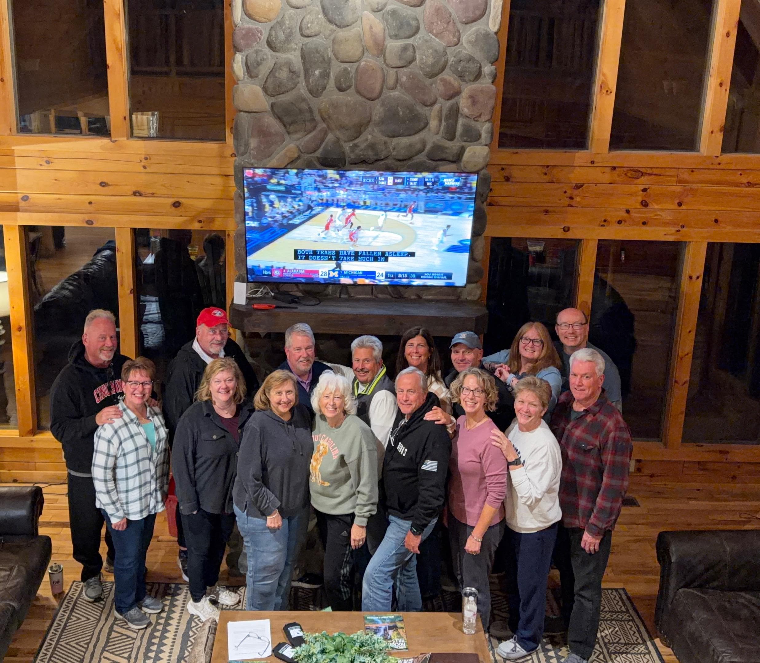 The whole group with the help of the upstairs banister holding the cell phone with a little Saran Wrap!