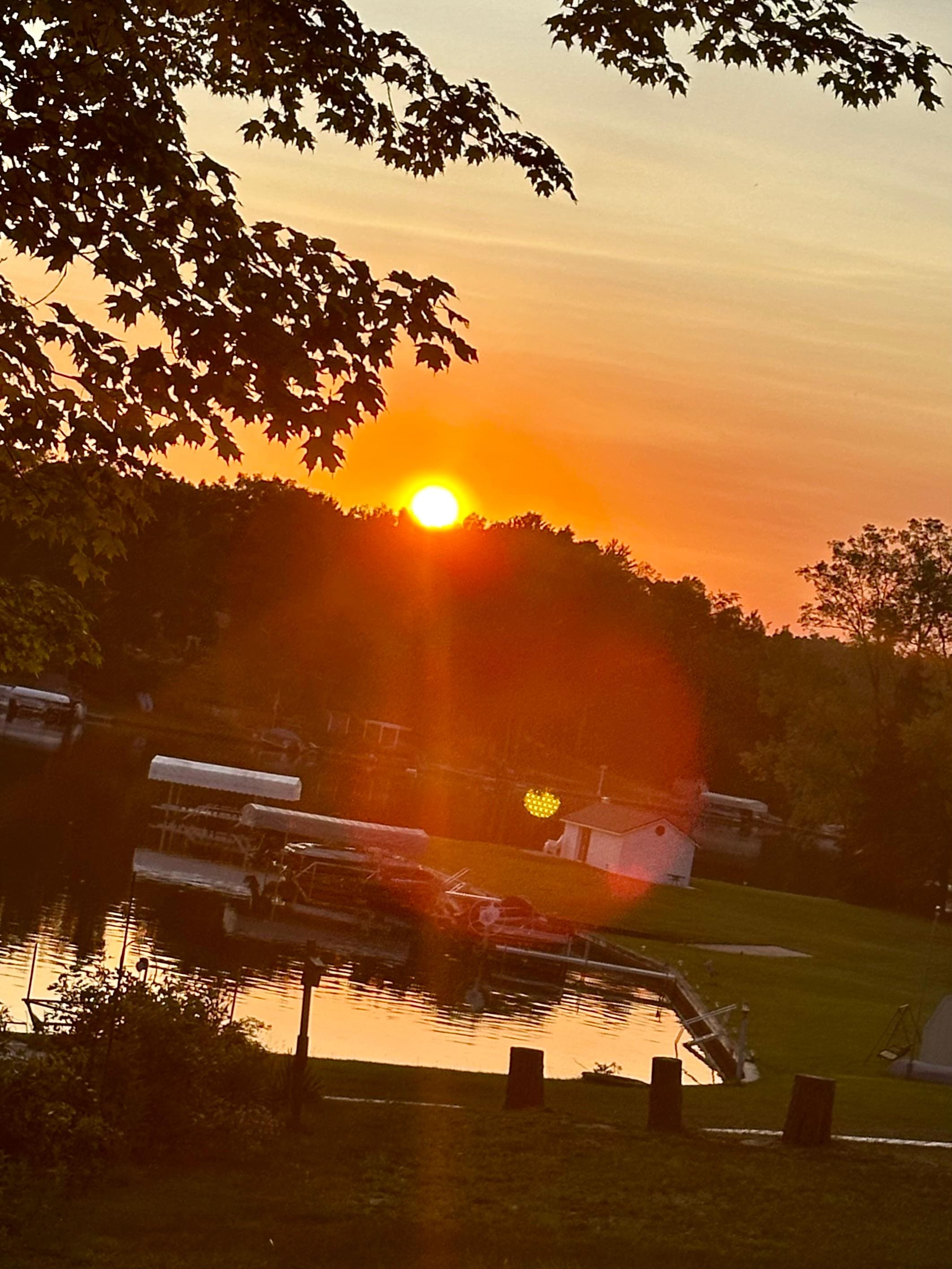 Sunset from sun porch at property.