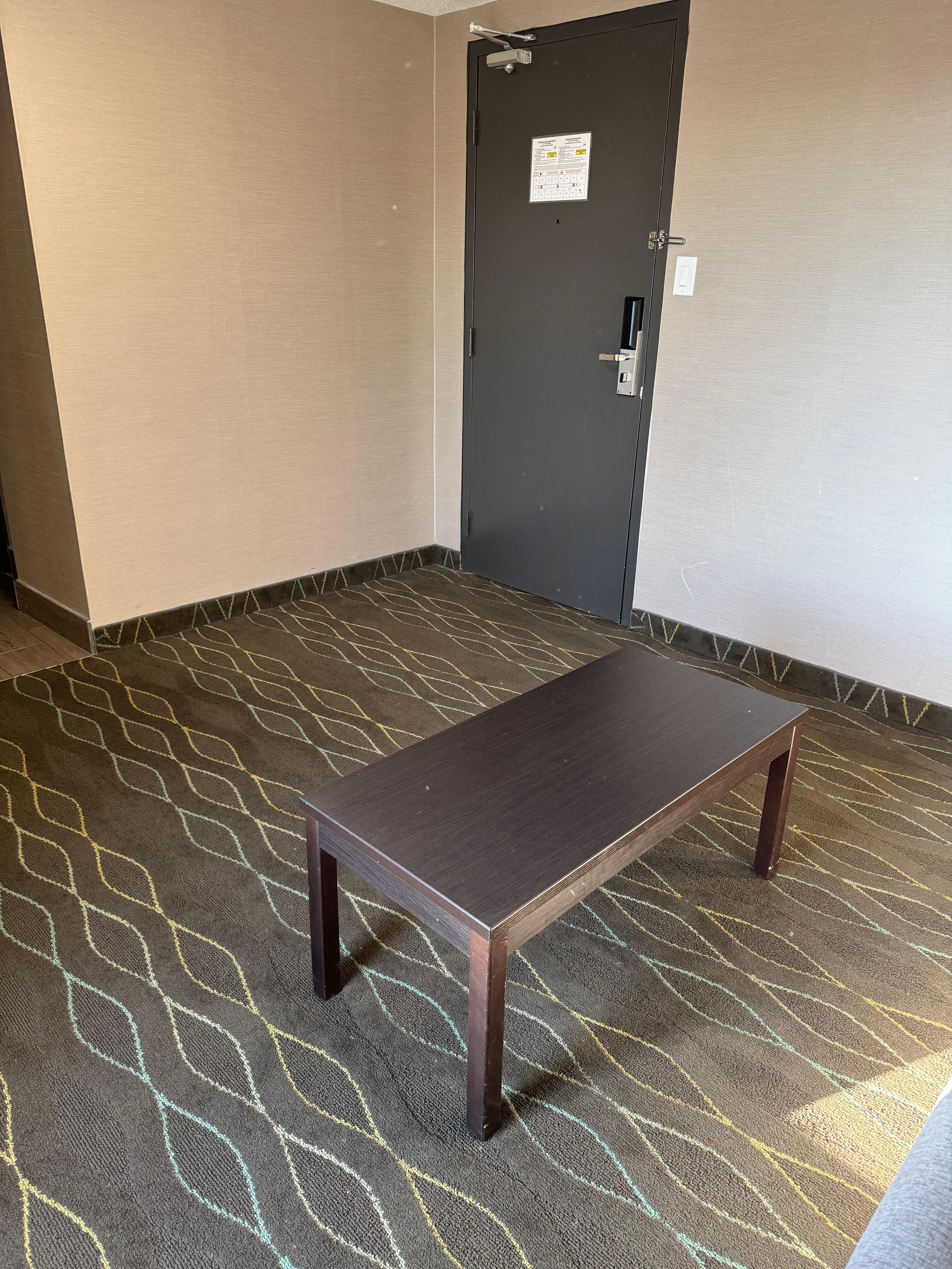 This is their idea of a suite. A virtually empty room with a sofa bed that doesn’t close and a coffee table. 