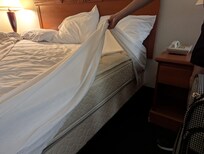 Bed not made with a liner. Only with a top sheet, not tucked in
