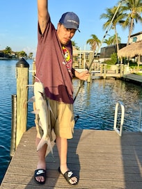 Son catching a huge catfish