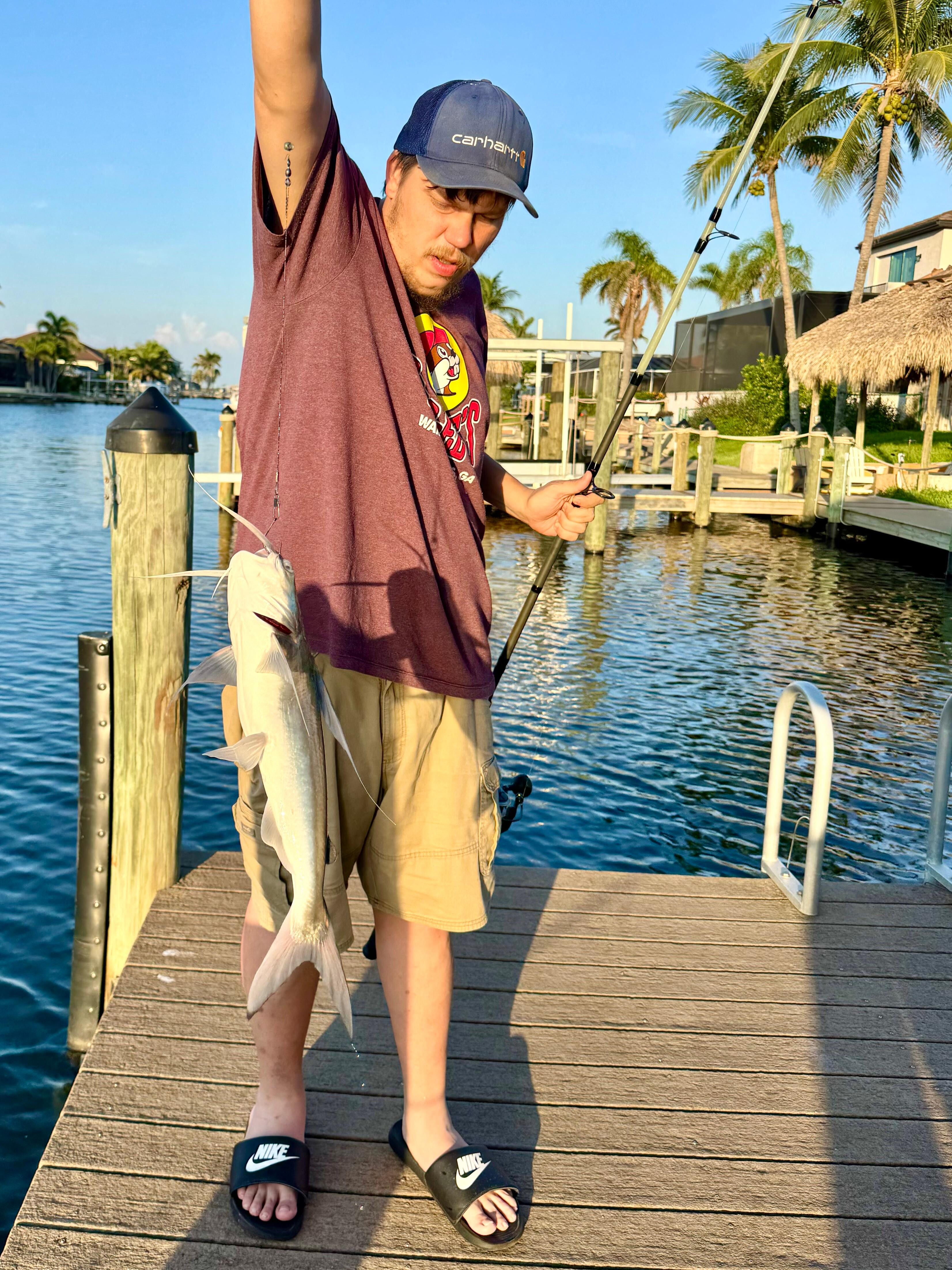 Son catching a huge catfish