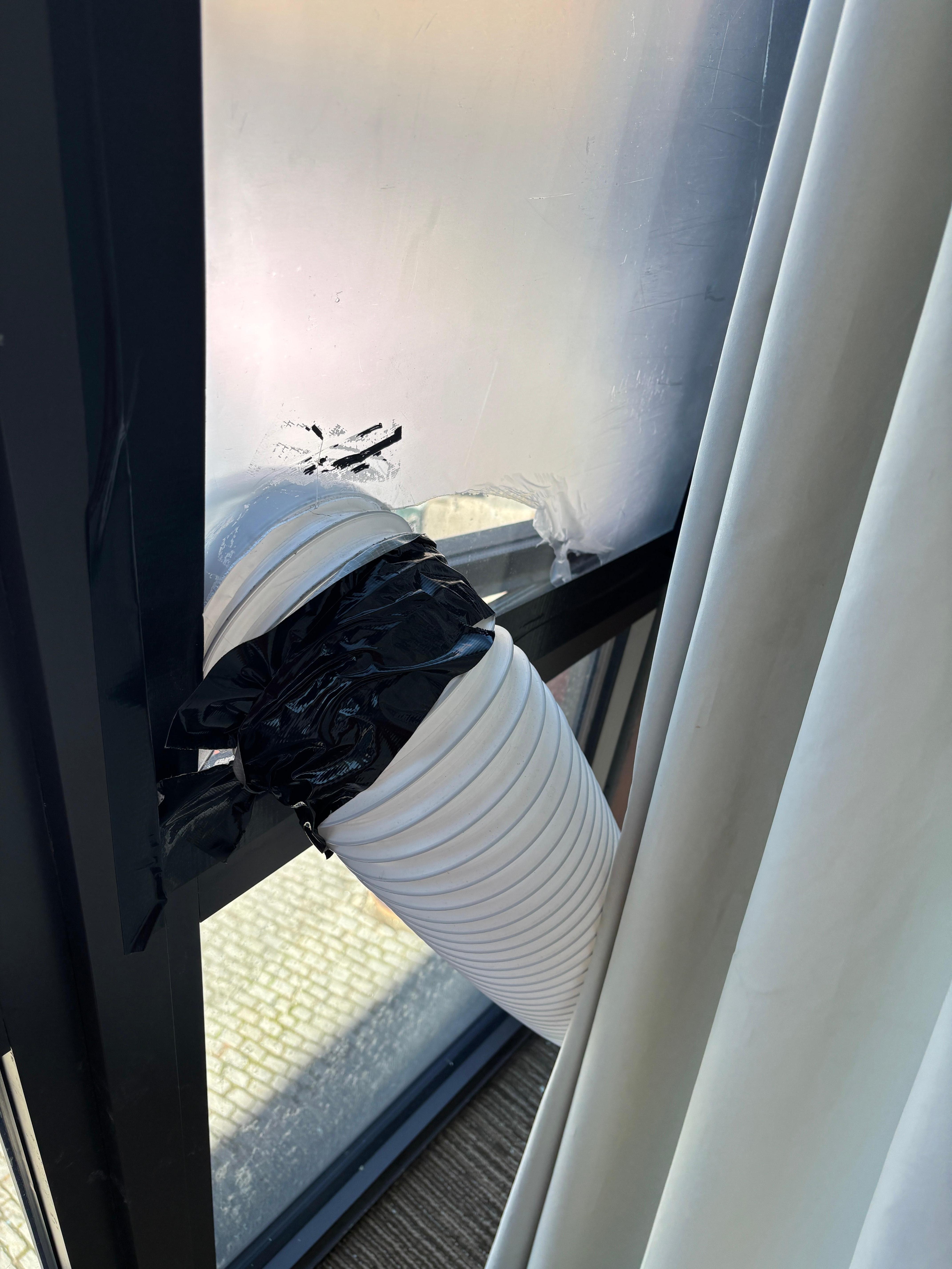 Window with pounds of electrical tape around it.  Then having an air vent tube sticking out of the window with plastic over it for $300+ dollars a night. I don't believe this was acceptable. The room should have been discounted. 