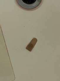 Bandaids clogging up tub drain.