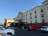 The hotel sets about 100 yards off the main road, but you can see from the road.