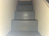 Indoor steps 9 inches in height. The top step is 9+ inches high.